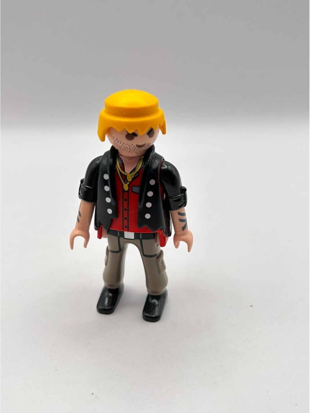 Playmobil ©2009 Geobra Rocker Figure Yellow Hair Tattoos Black Vest Red Shirt